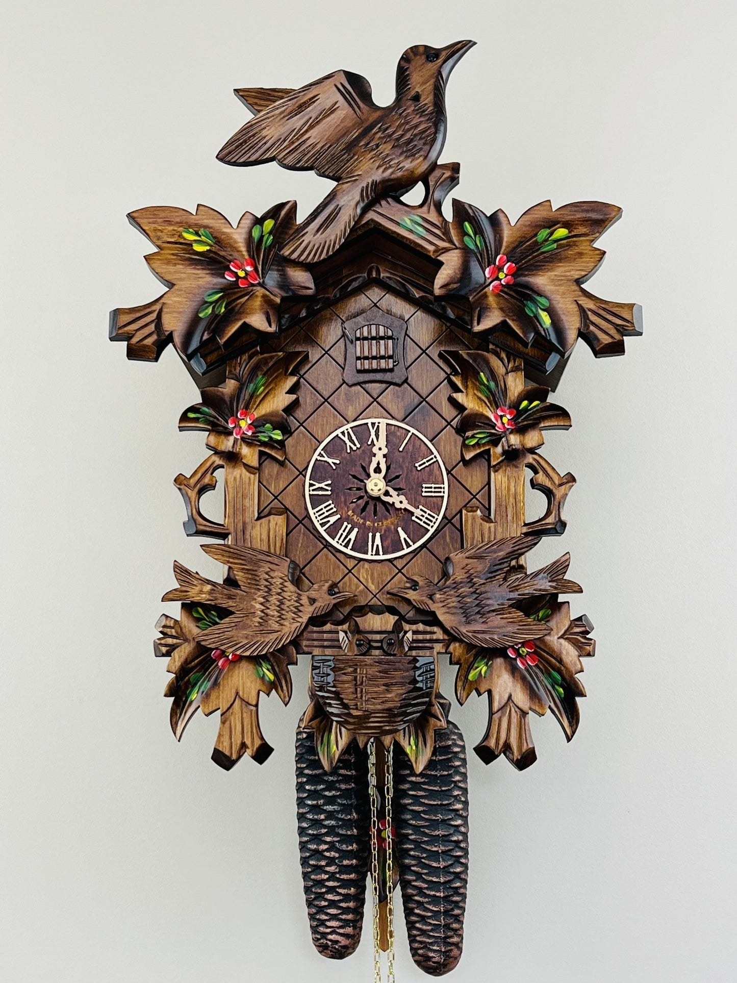 River City Clocks 16" Eight Day Cuckoo Clock with Hand-painted Flowers, Leaves, and Animated Birds Feeding Baby Birds