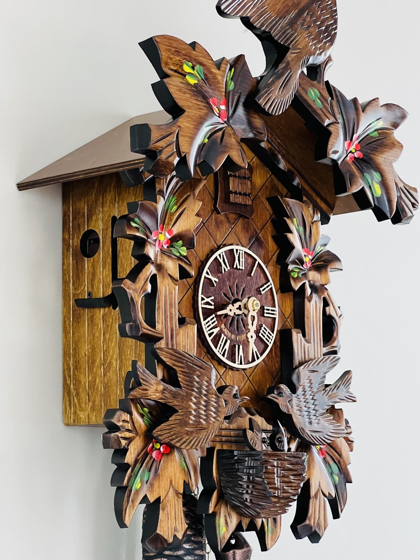 River City Clocks 16" Eight Day Cuckoo Clock with Hand-painted Flowers, Leaves, and Animated Birds Feeding Baby Birds